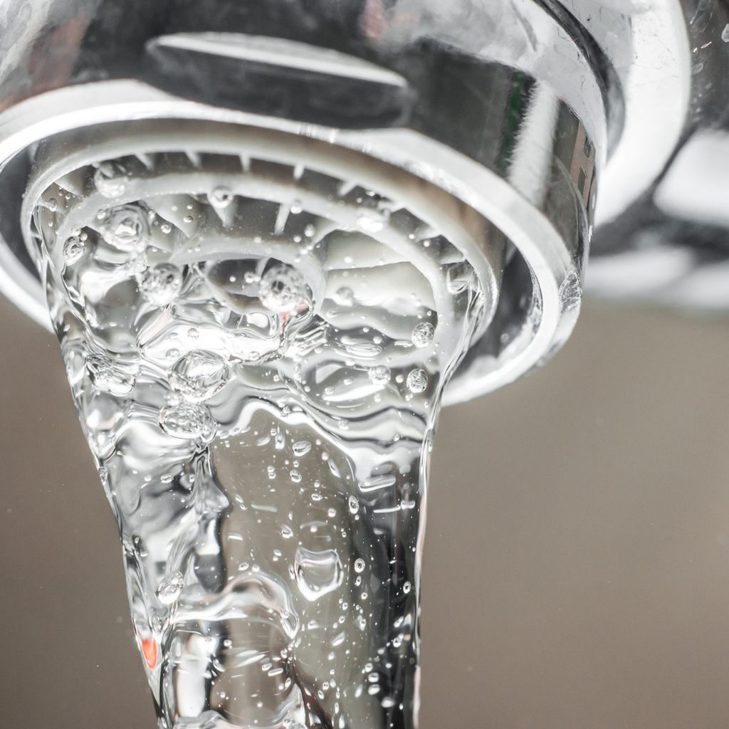 Close up photo of a chrome tap with an aerator fitted