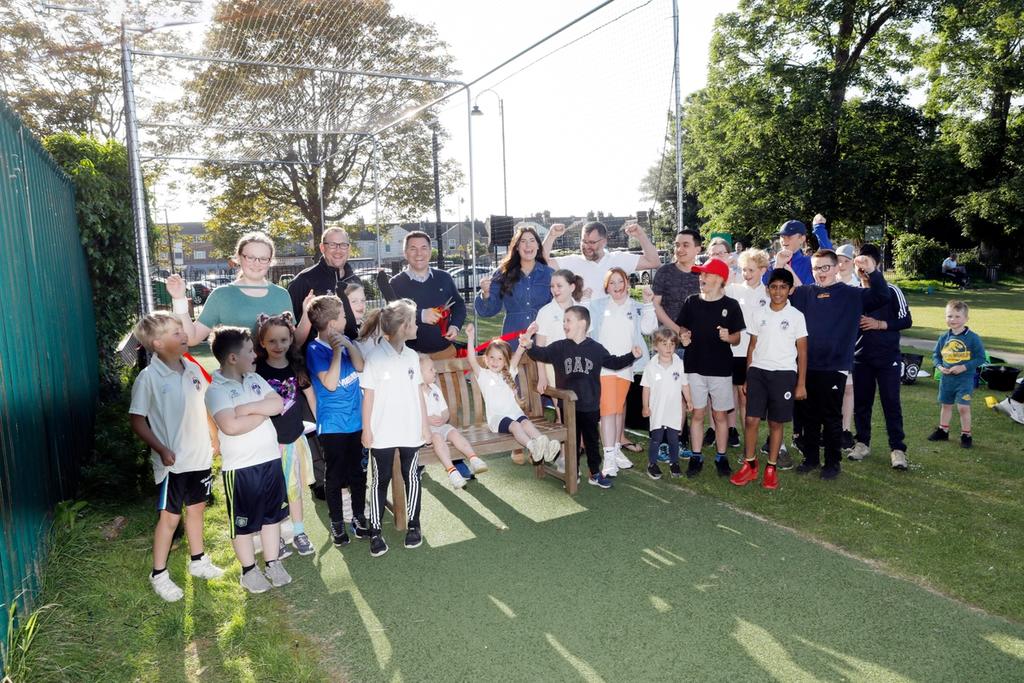 A group of school children in a playing field