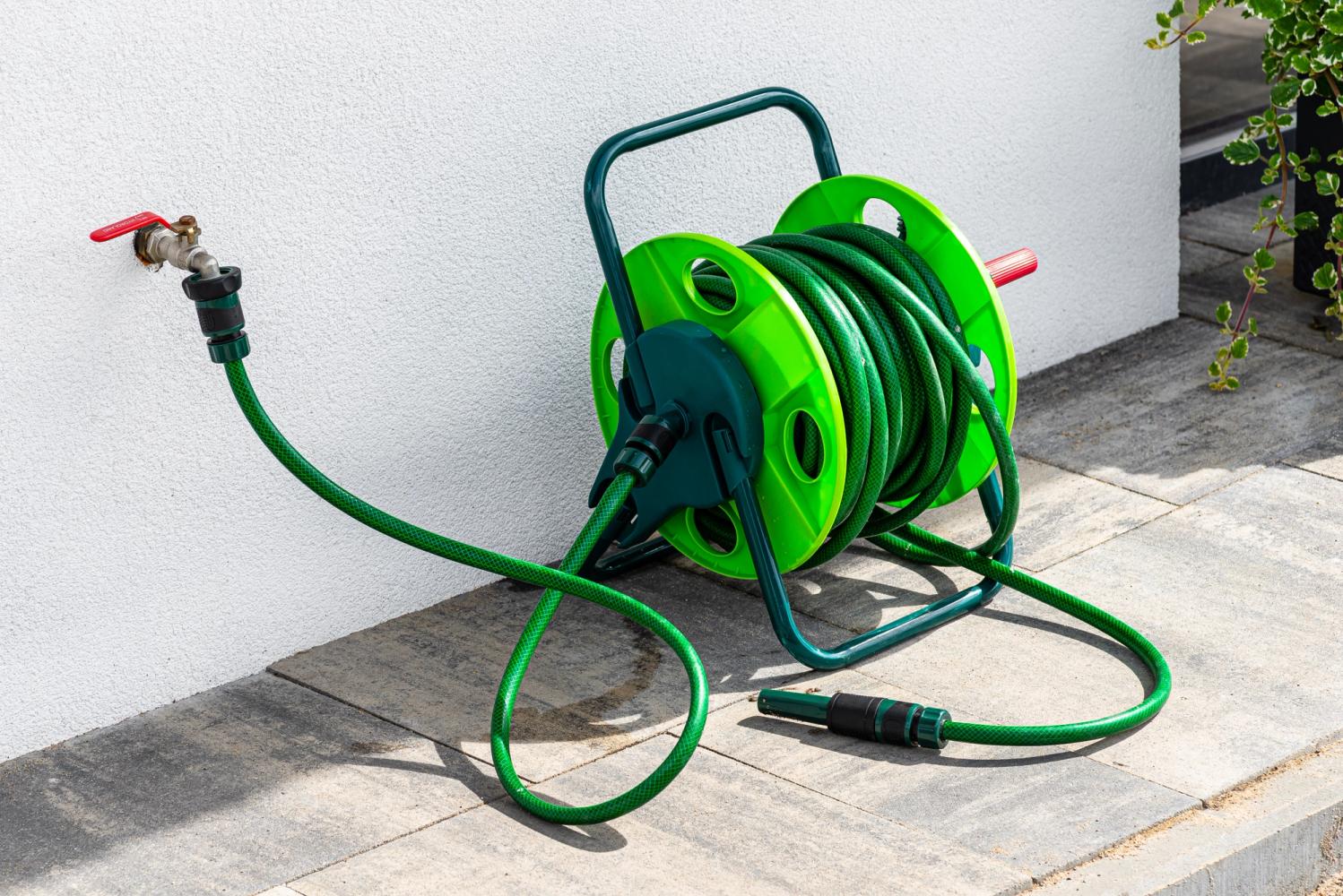 A reeled in green hosepipe. 