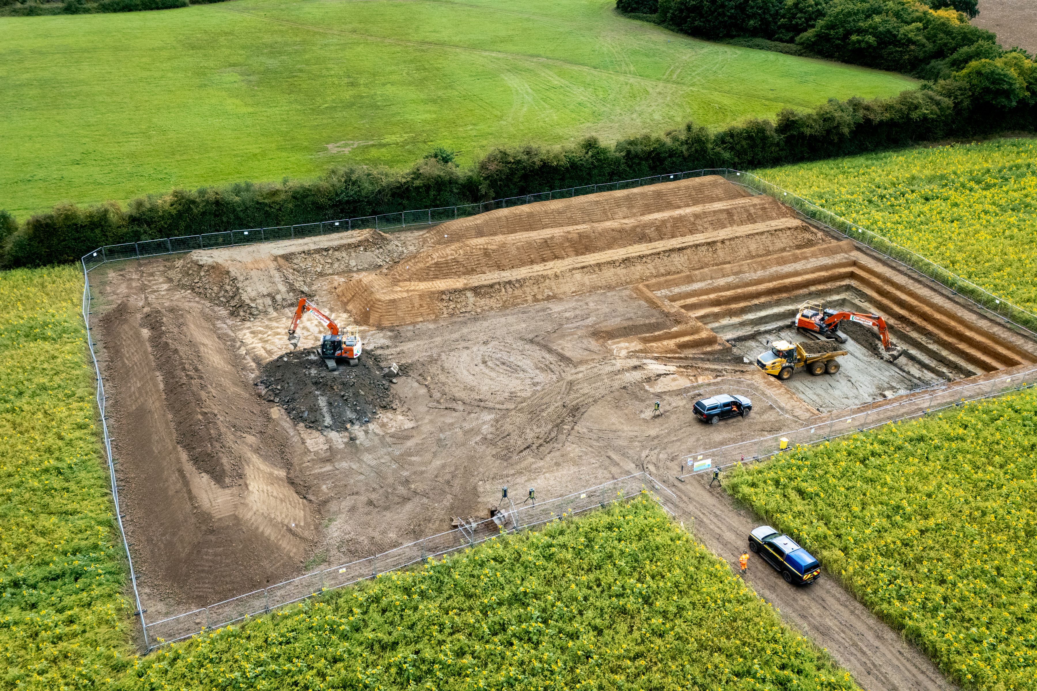 Image of ground investigations taking place with trial pit