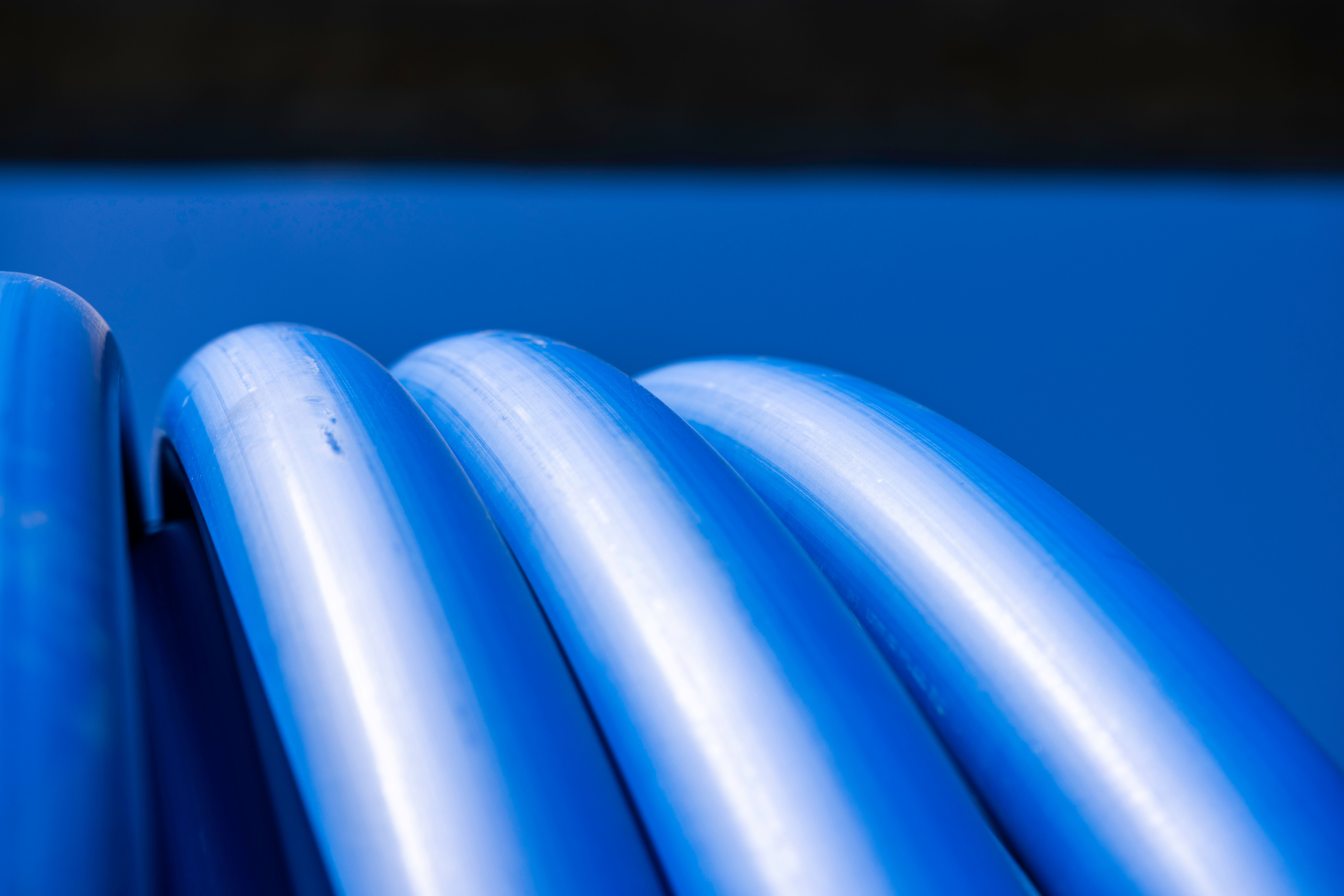 Blue pipe shines in the sunlight