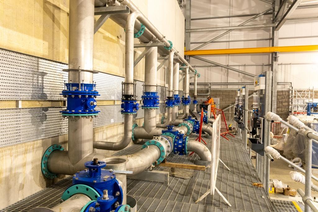 Pipes coming out of a large wall containing hydrocarbon filters