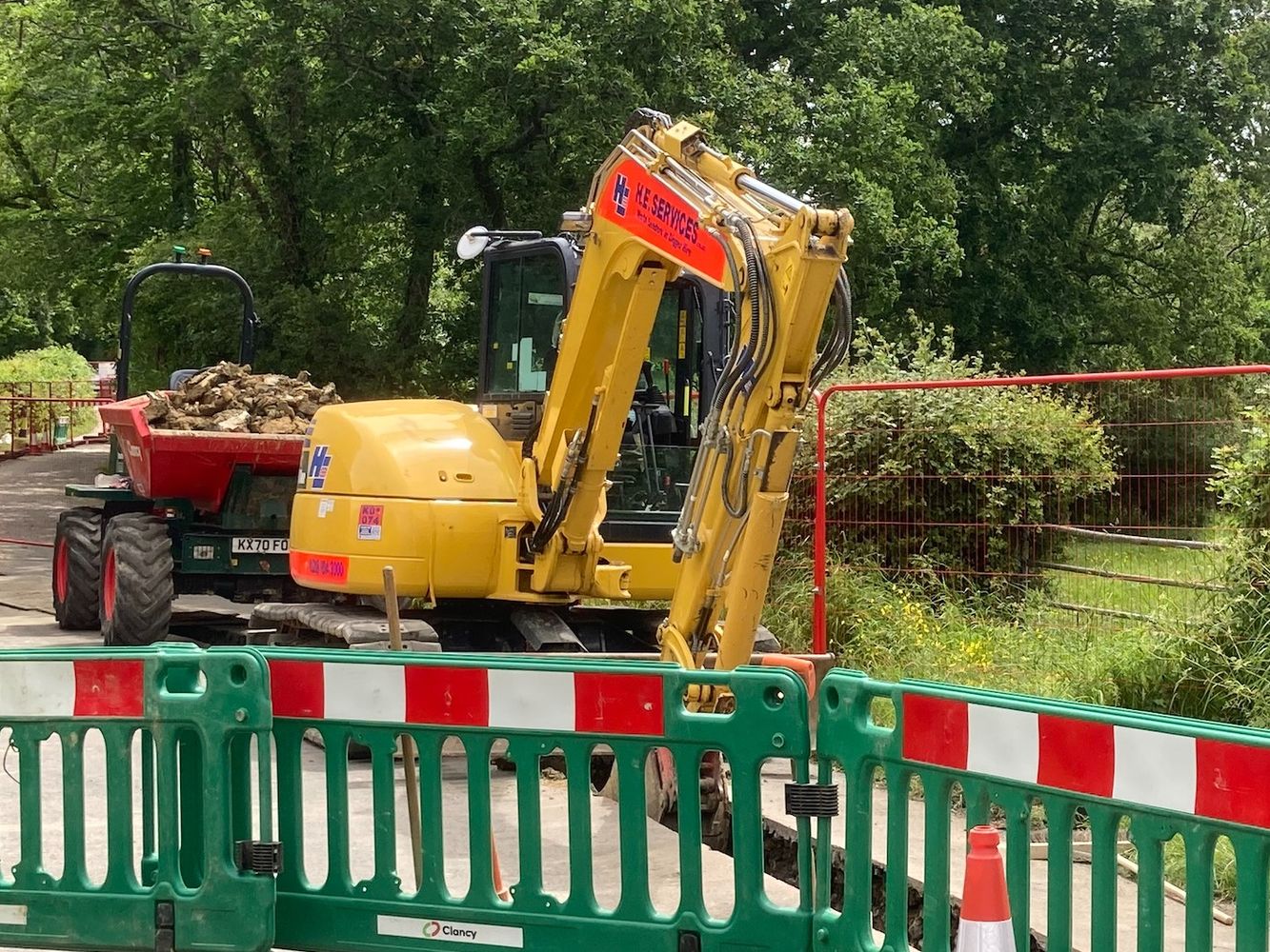 Workmen laying pipe