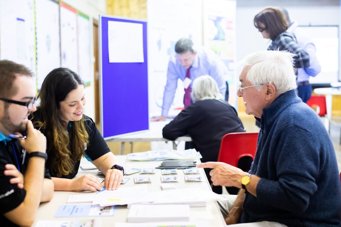 Customer Care Advisors James and Vicky talk to visitors at a drop-in session