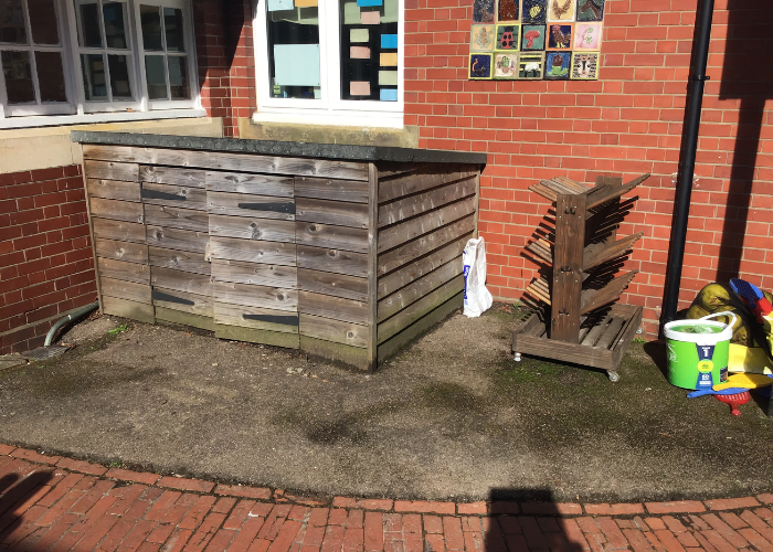 An image of the current space. The school plans to have French doors put in to turn this space into an eco-garden with water butts, raised borders, seating and areas for children to work.