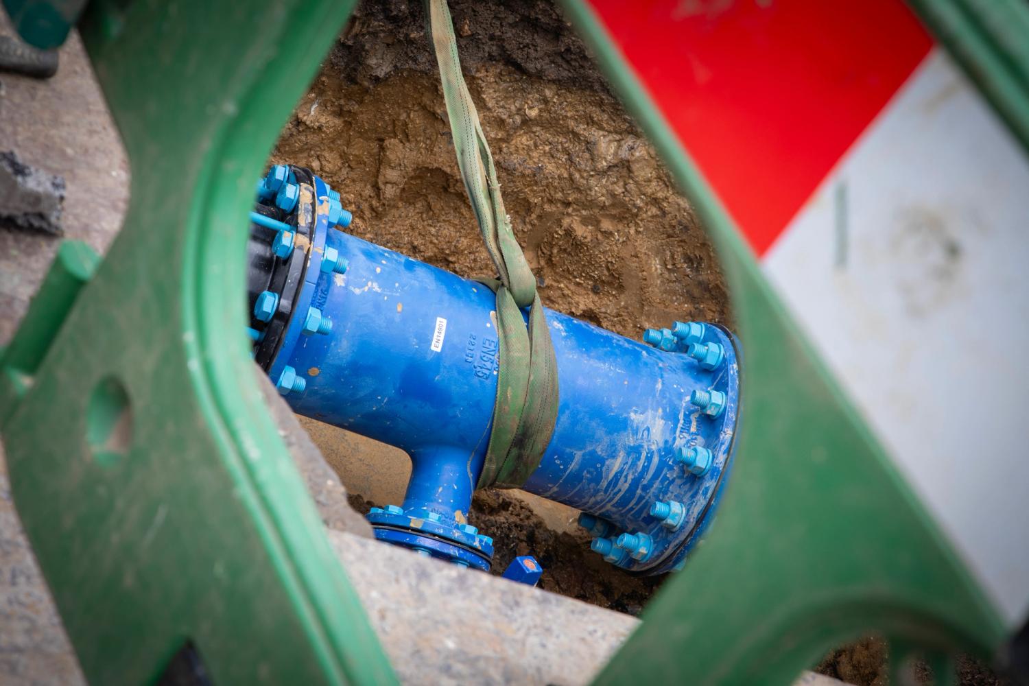 Pipework is seen through a barrier