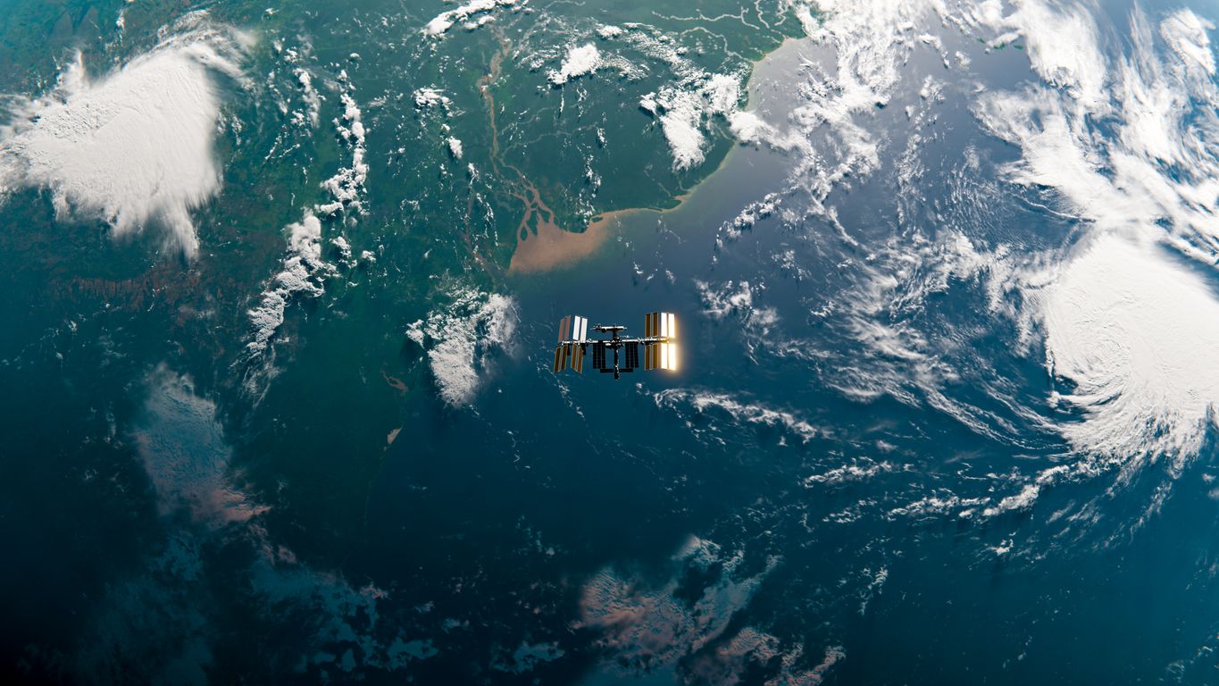Image of a satellite in orbit above the Earth 