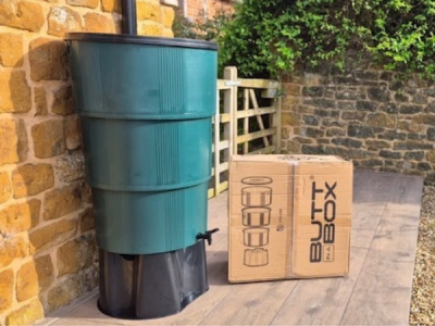 Image of an assembled 'Butt in a Box' with cardboard packaging box next to it.
