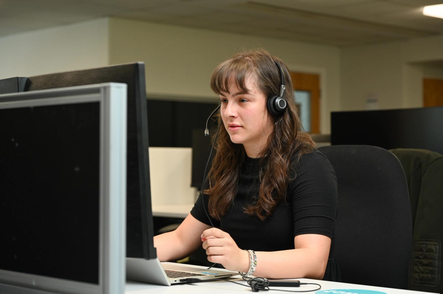 South East Water customer services adviser sitting at her desk