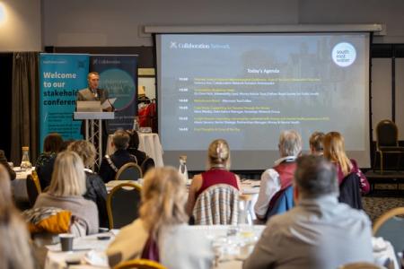 Photo of a South East Water employee presenting to an audience of stakeholders at an event