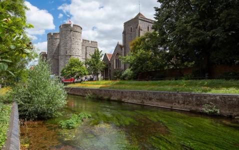 River stour next to a castle and chruch 