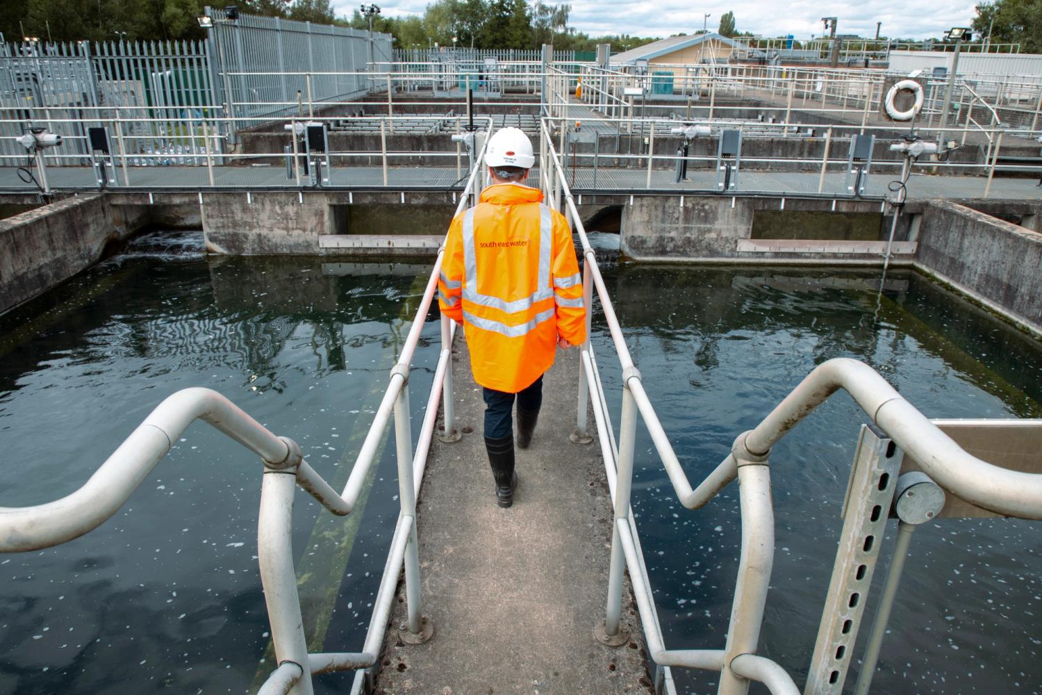 Photo of a SEW employee wearing a hi-vis jacket at a Water Treatment Works