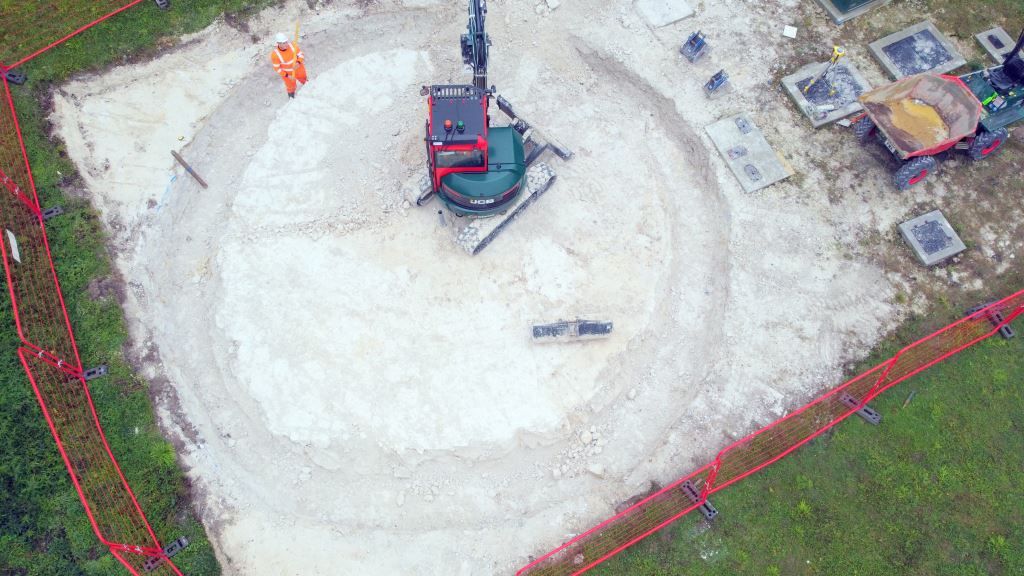 Image shows a circular trench being dug out as ground work progresses