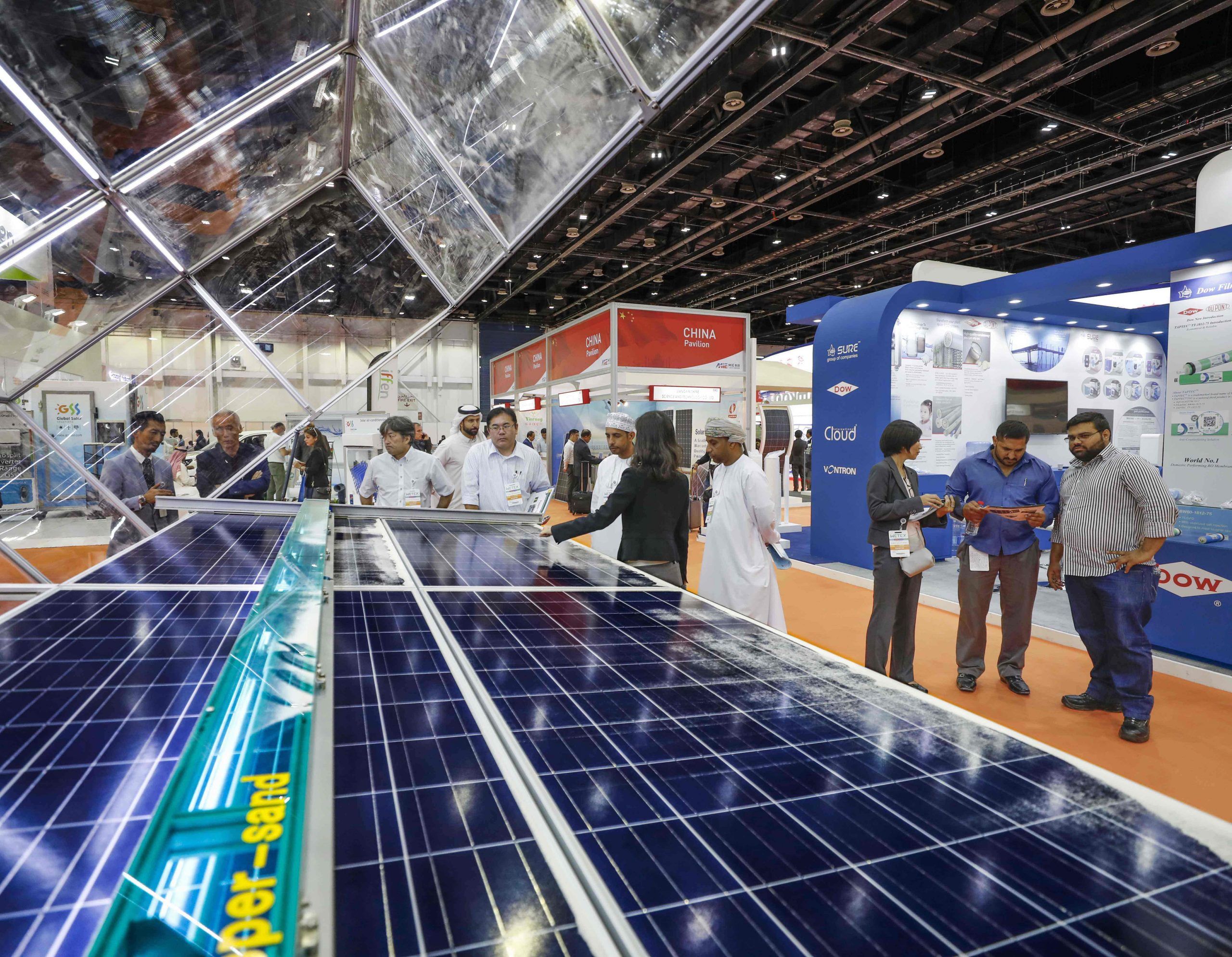 Renewable energy and sustainability solutions showcased at a business exhibition in Qatar.
