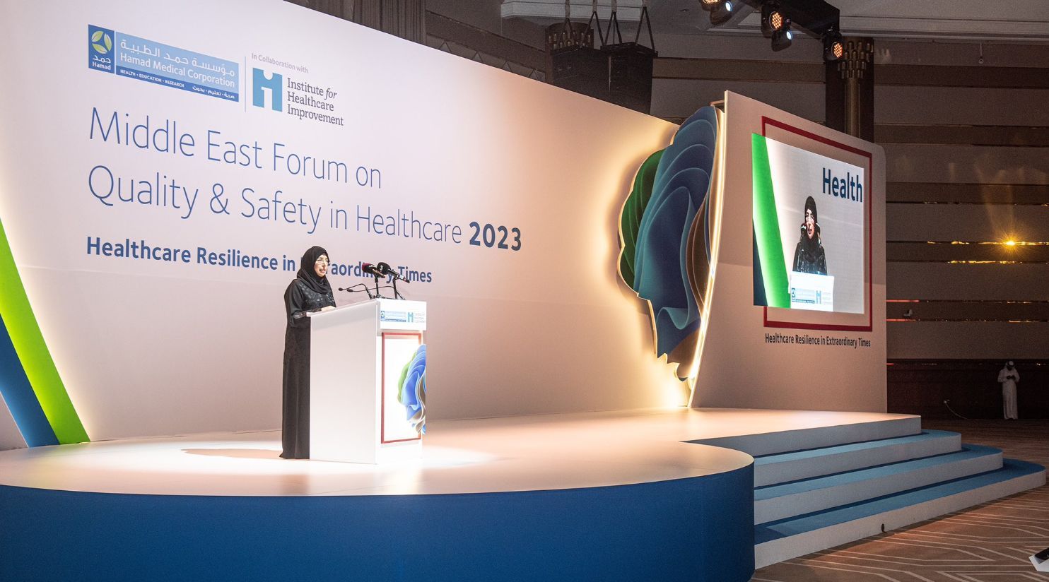 Healthcare professionals exploring medical technologies during an exhibition in Qatar.