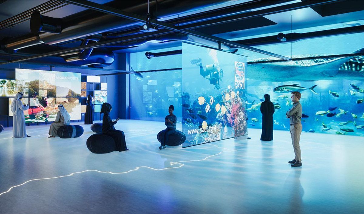 Interactive exhibition stand in Qatar featuring digital displays, LED screens, and immersive visitor experiences