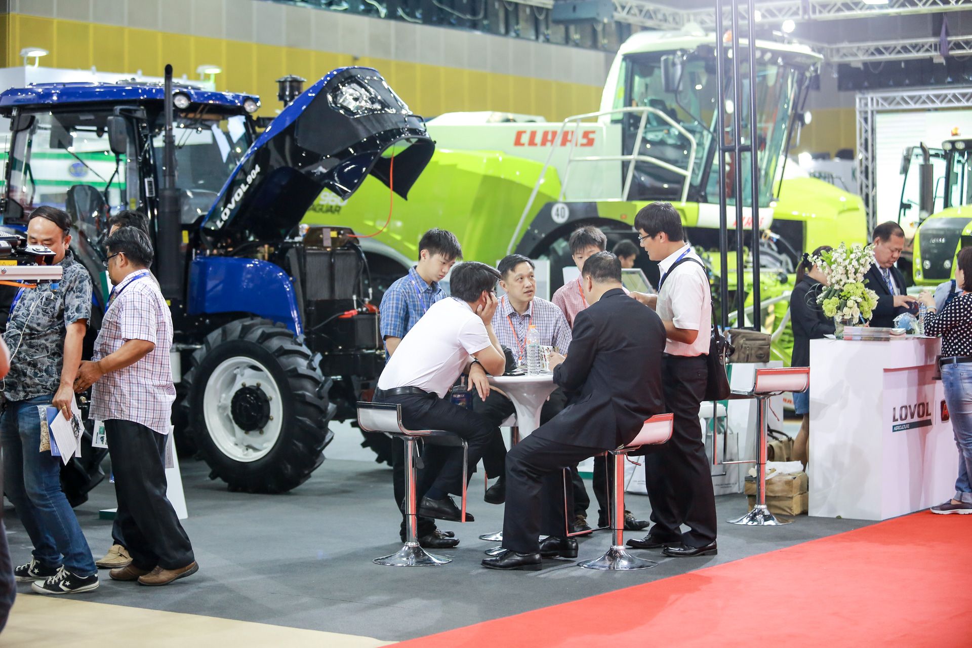 Live agricultural equipment demonstration at outdoor exhibition show