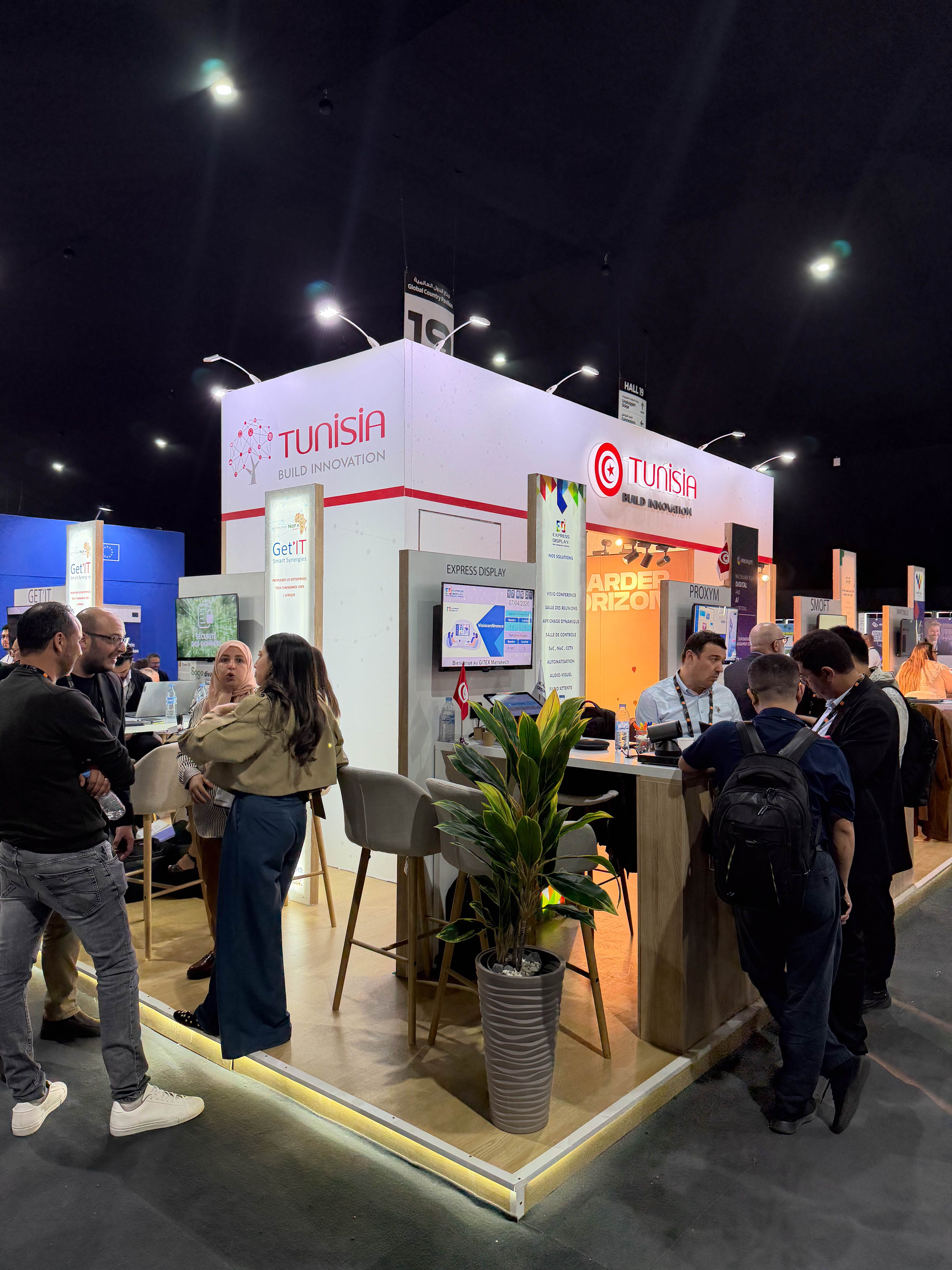 A branded exhibition stand attracting visitors at an international trade fair.