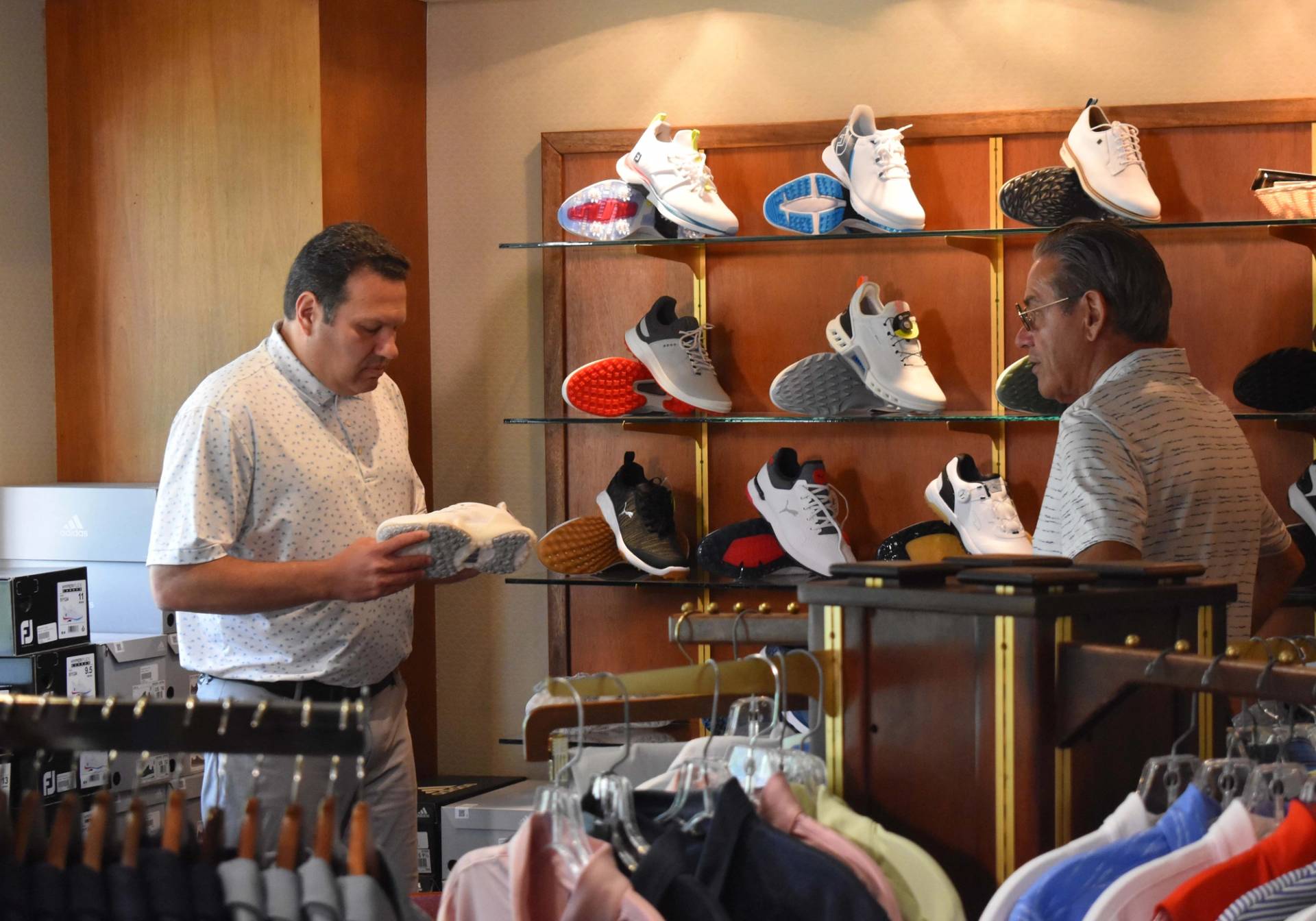 Guys in golf shop