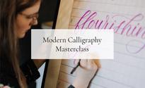 calligraphy instructor demonstrating for a class
