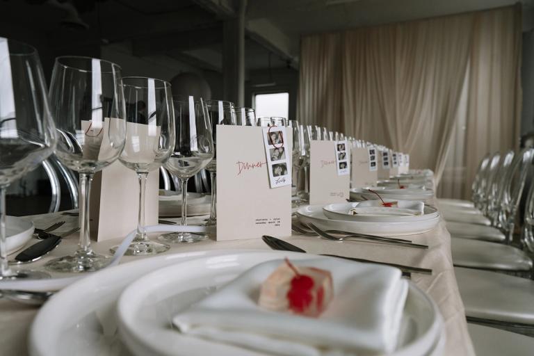 Wedding menus with polaroids on table