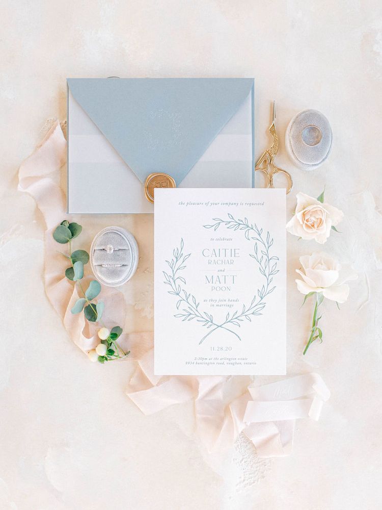 Fine art dusty blue wedding invitation suite with gold wax seal.