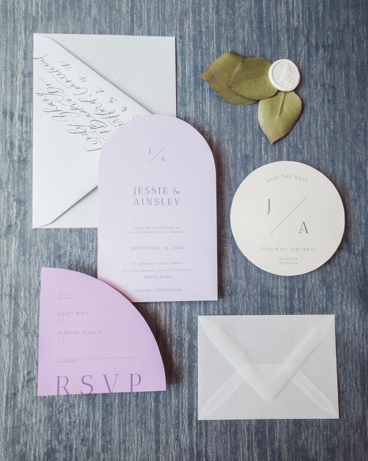 Modern alternative wedding invitation featuring purple laser cut shapes