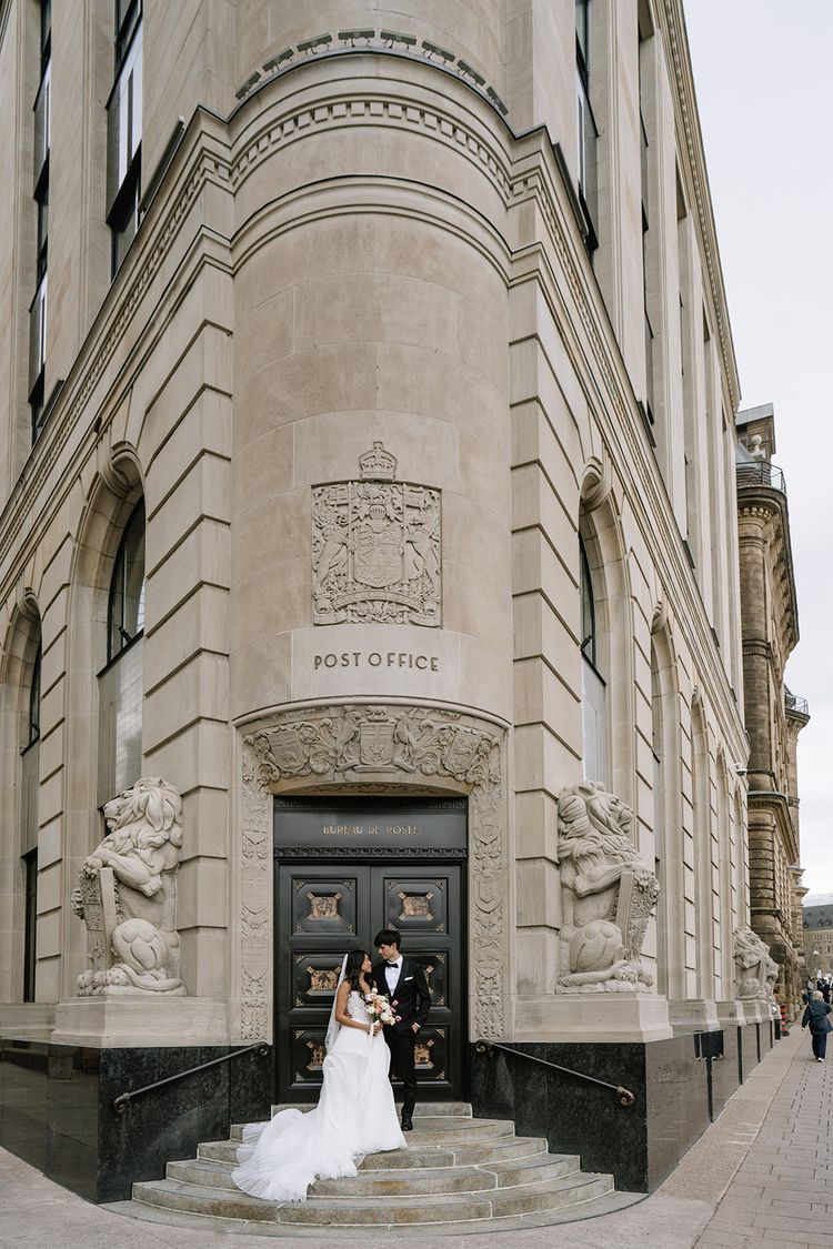 wedding couple in front of ottawa post office