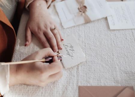 Ottawa Calligrapher doing live calligraphy for guests at a brand activation.