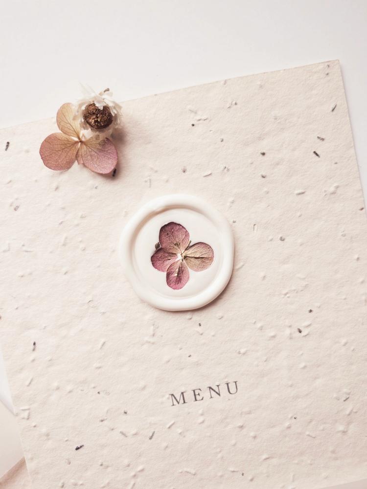 Dried floral wax seal on menu