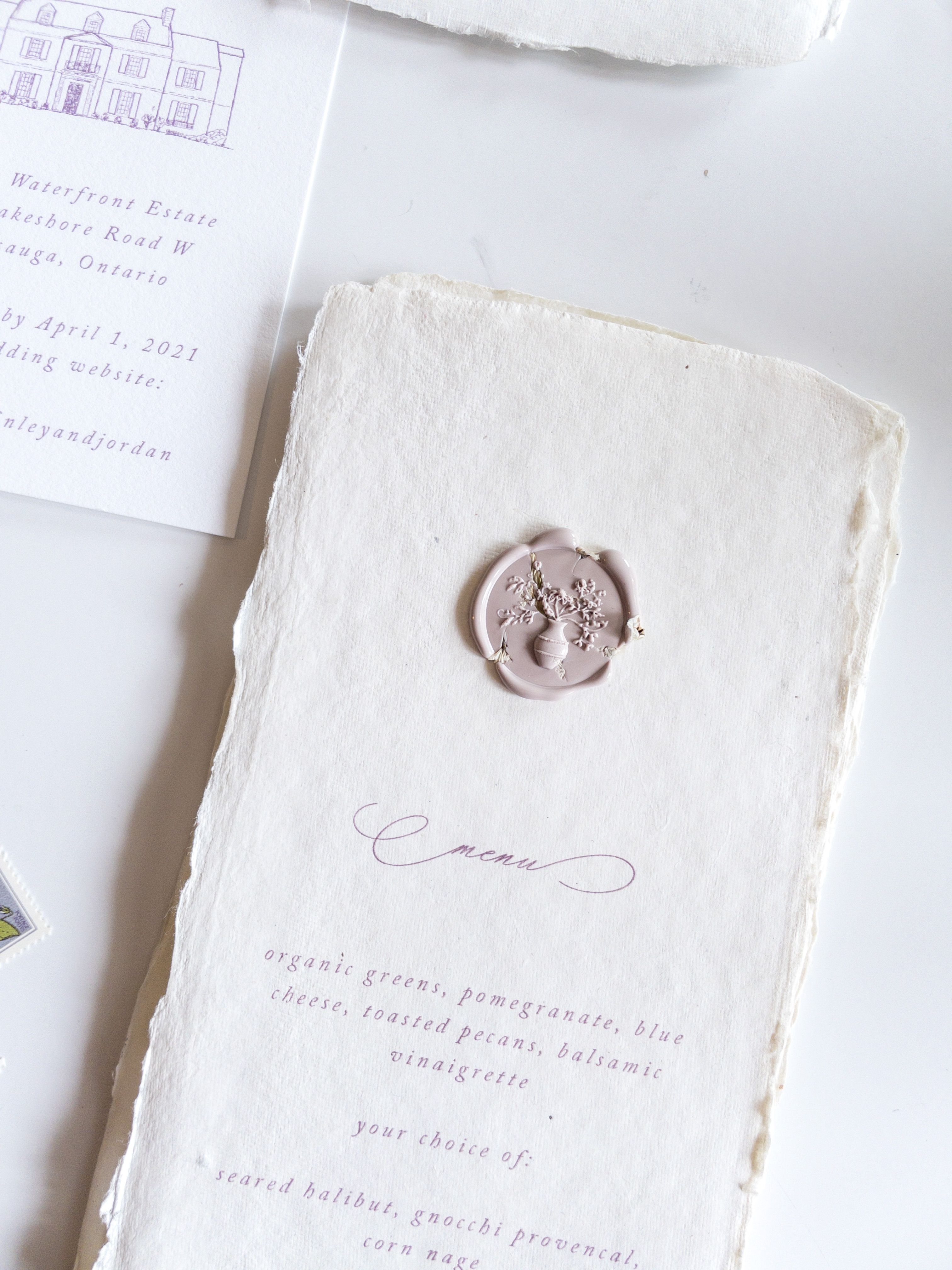Handmade paper menus with dried floral wax seals