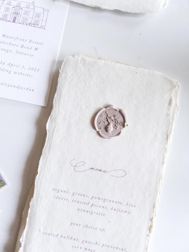 Handmade paper menus with dried floral wax seals