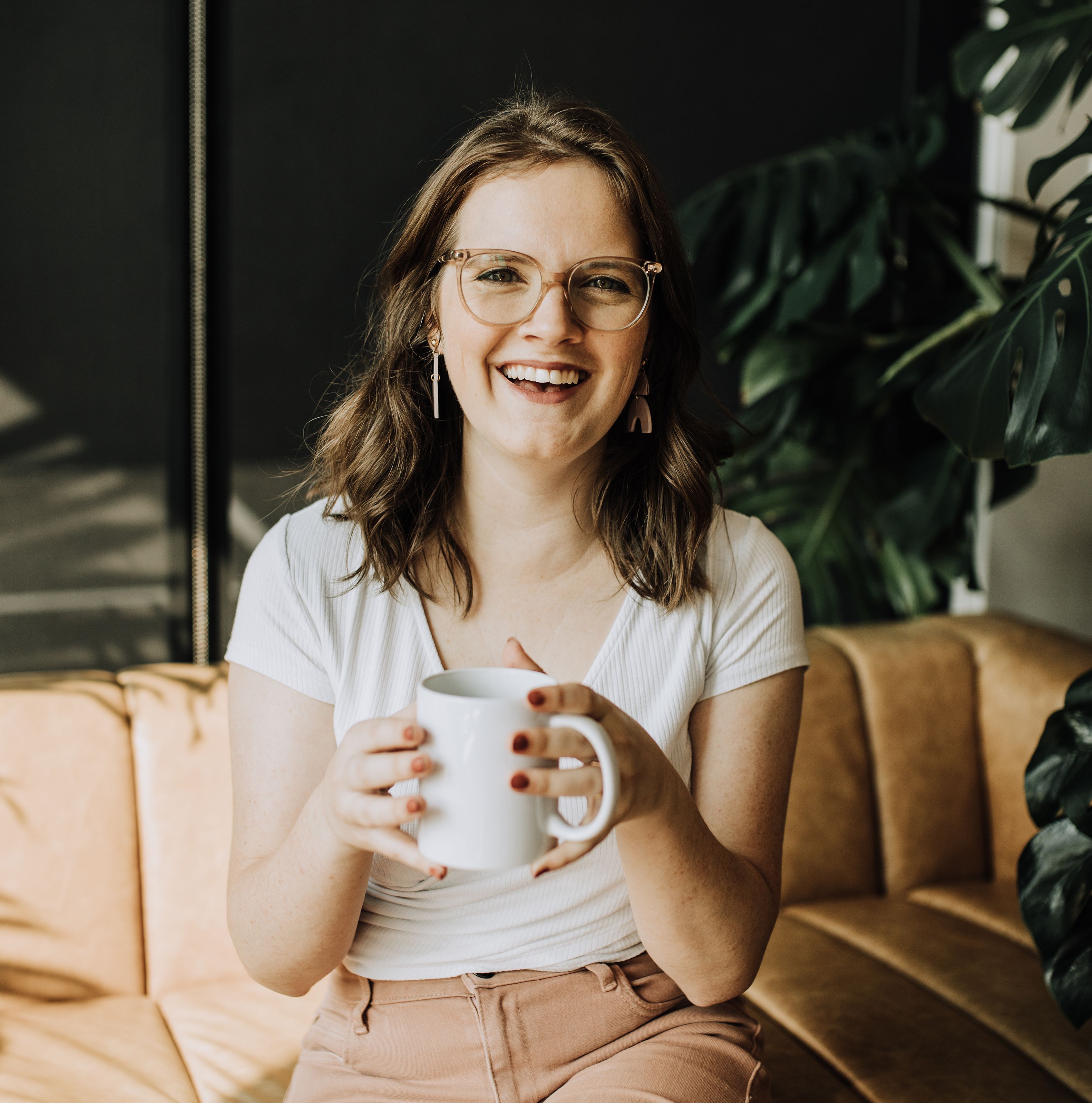 Cody posing and smiling with coffee
