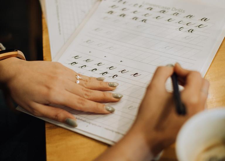 Student learning modern calligraphy