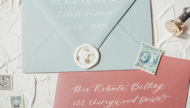 Soft white wax seal with flecks of gold leaf