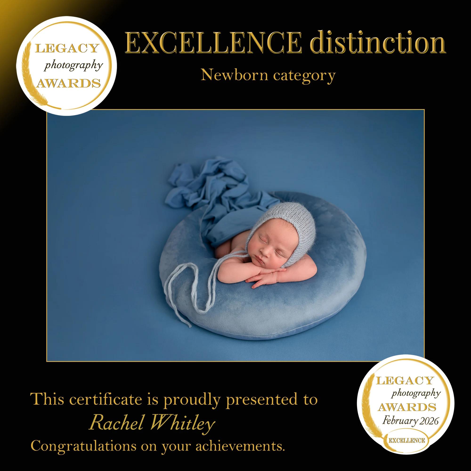 Legacy Photography Awards Excellence distinction, newborn category, February 2026 — sleeping baby in blue, photographed by Rachel Whitley