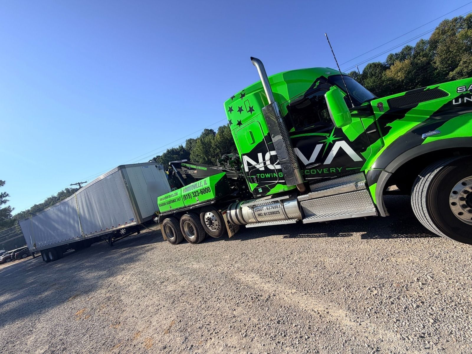 NOVA heavy-duty wrecker towing a 53-foot trailer