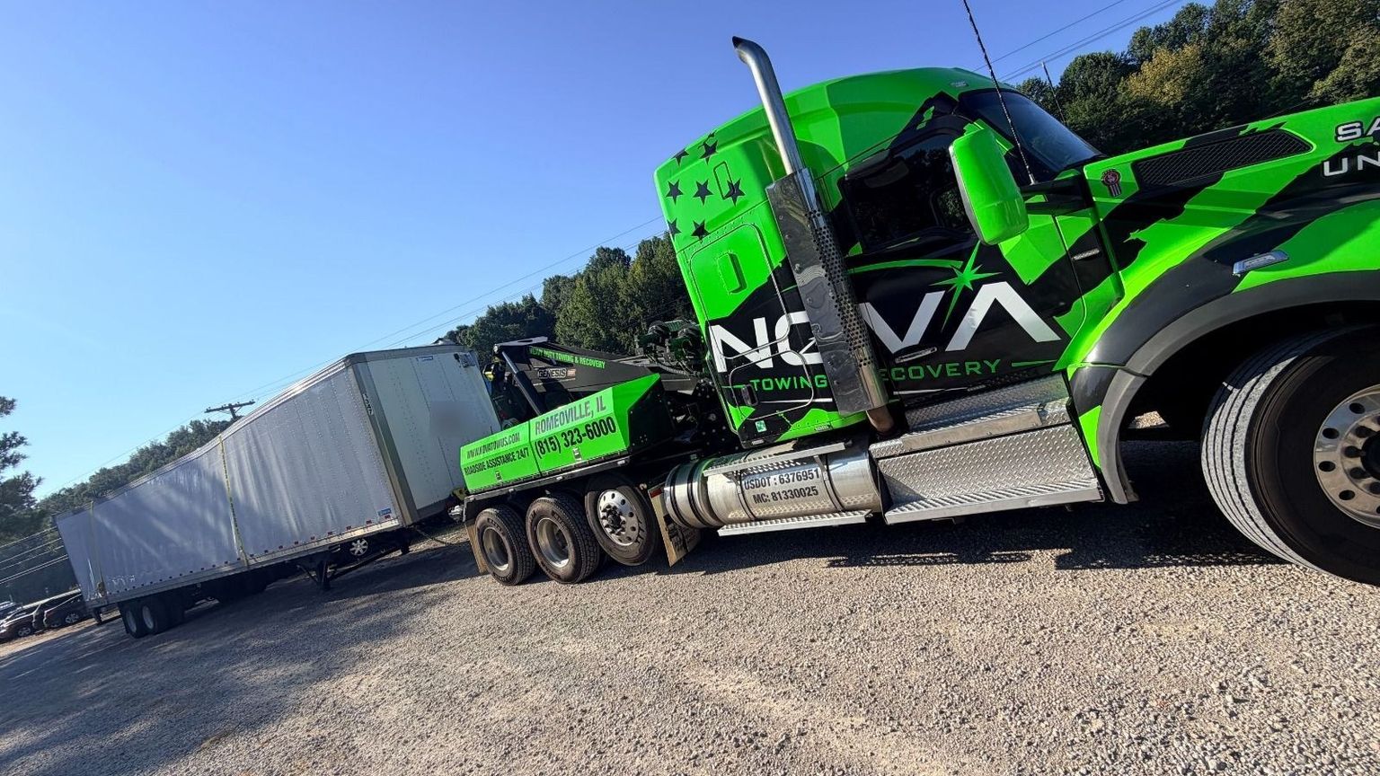 NOVA heavy-duty wrecker towing a 53-foot trailer