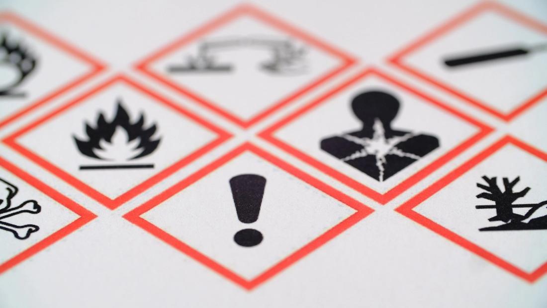 WHMIS GHS hazard pictograms — red diamond warning symbols including flammable, health hazard, and exclamation mark labels