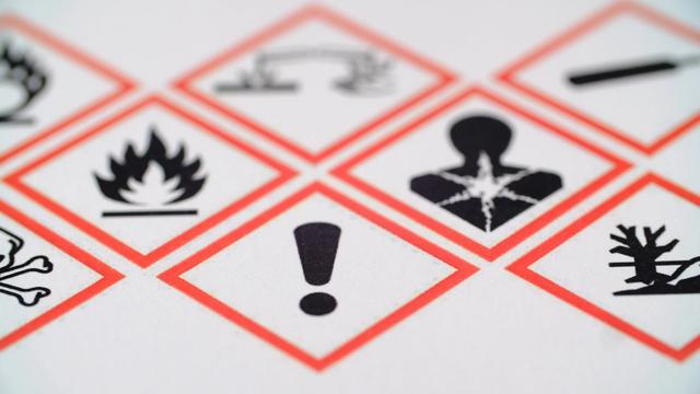 WHMIS GHS hazard pictograms — red diamond warning symbols including flammable, health hazard, and exclamation mark labels