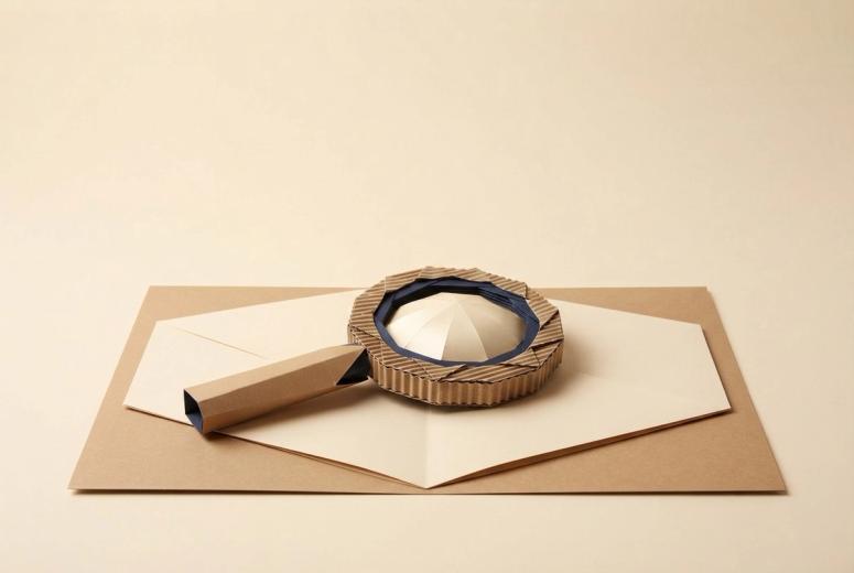 Paper-craft illustration of a folded paper clipboard on a kraft desk, holding a small cut-paper permit card beside a paper moving truck