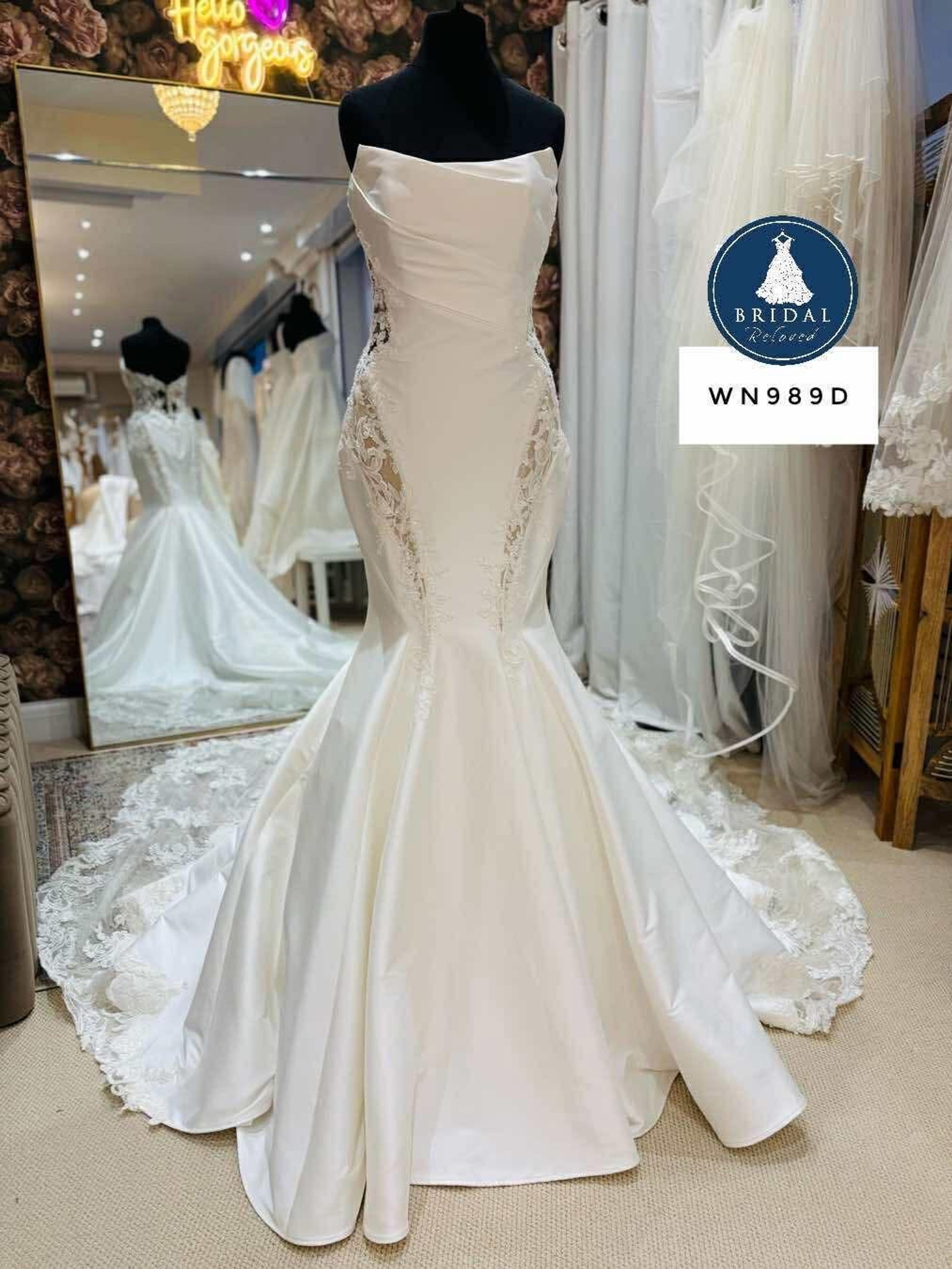 A fishtail wedding dress photographed on the rail