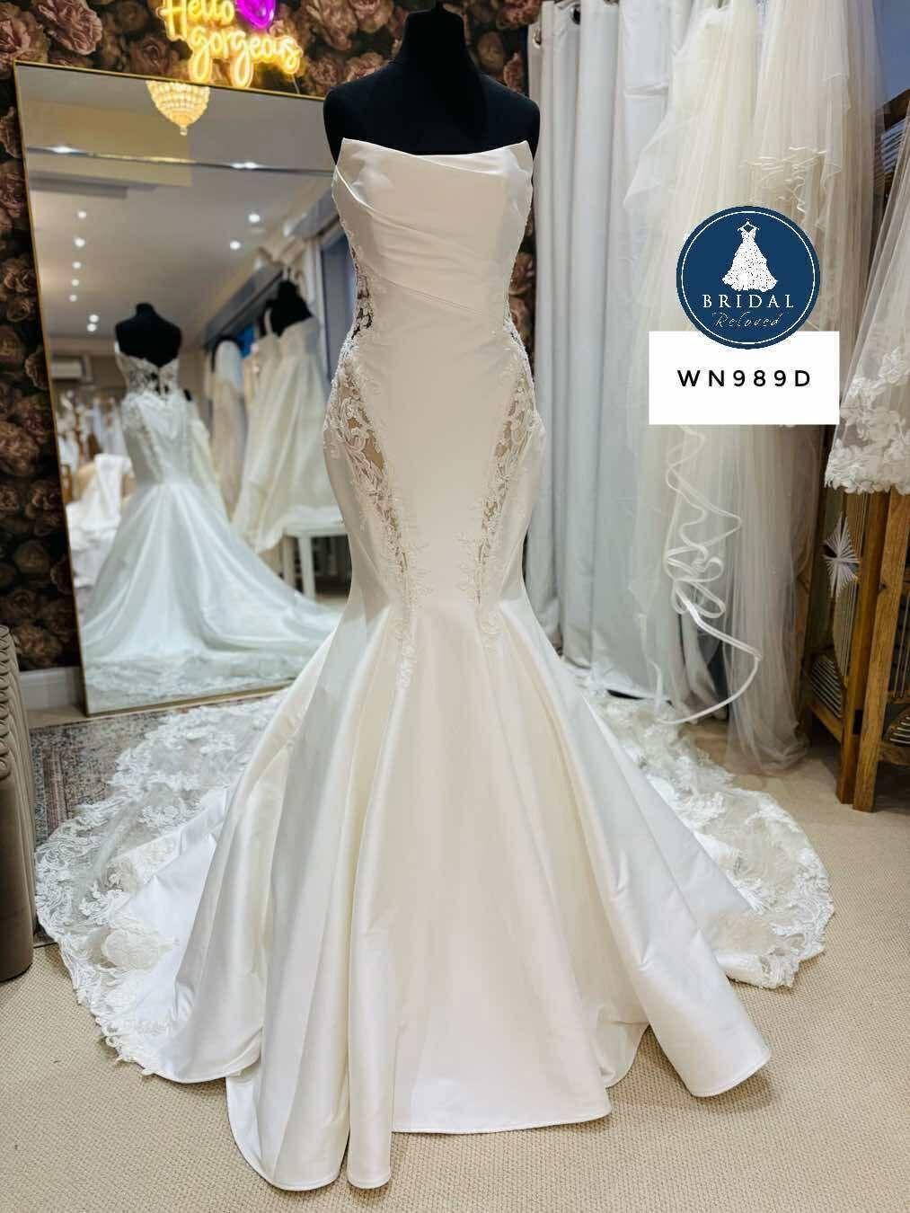 A fishtail wedding dress photographed on the rail