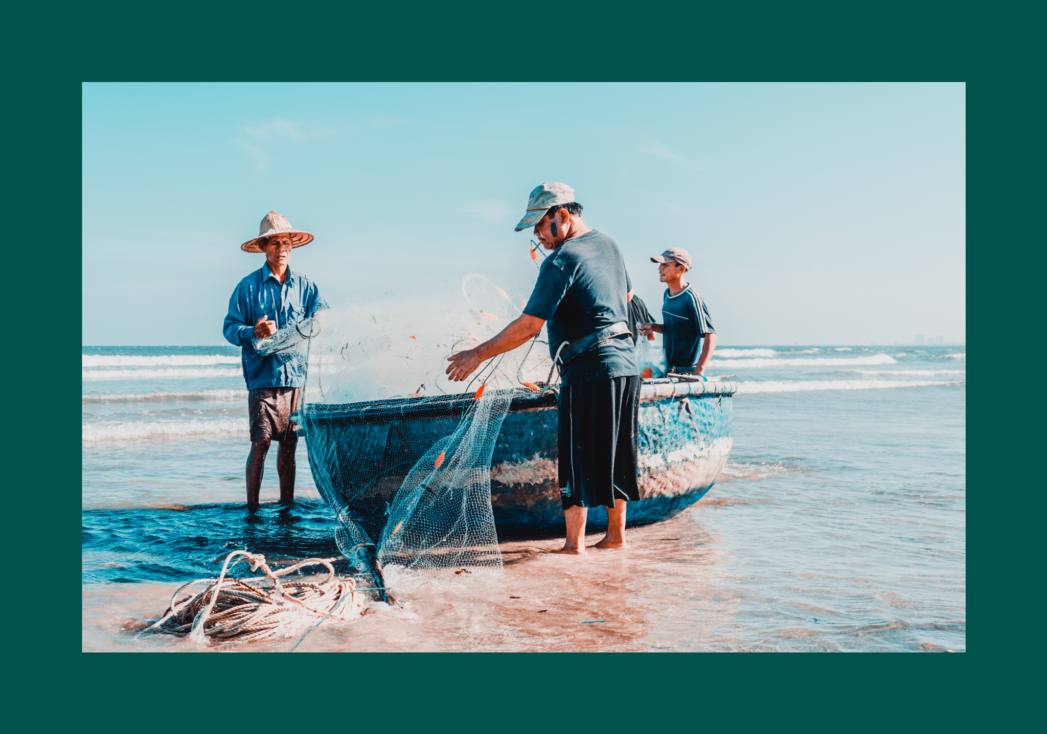 Three men stand around a small boat on beach, with a fishing net