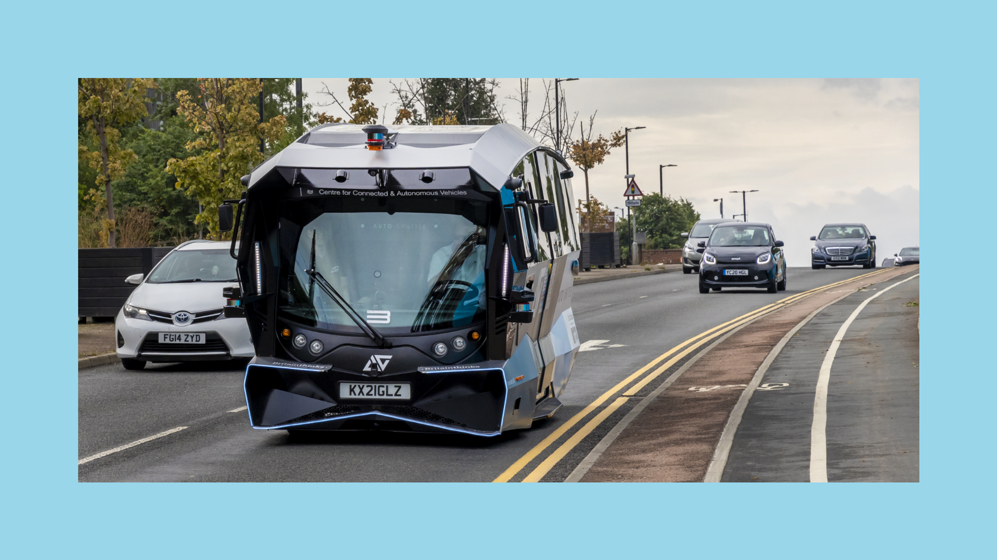Futuristic bus driving on main road