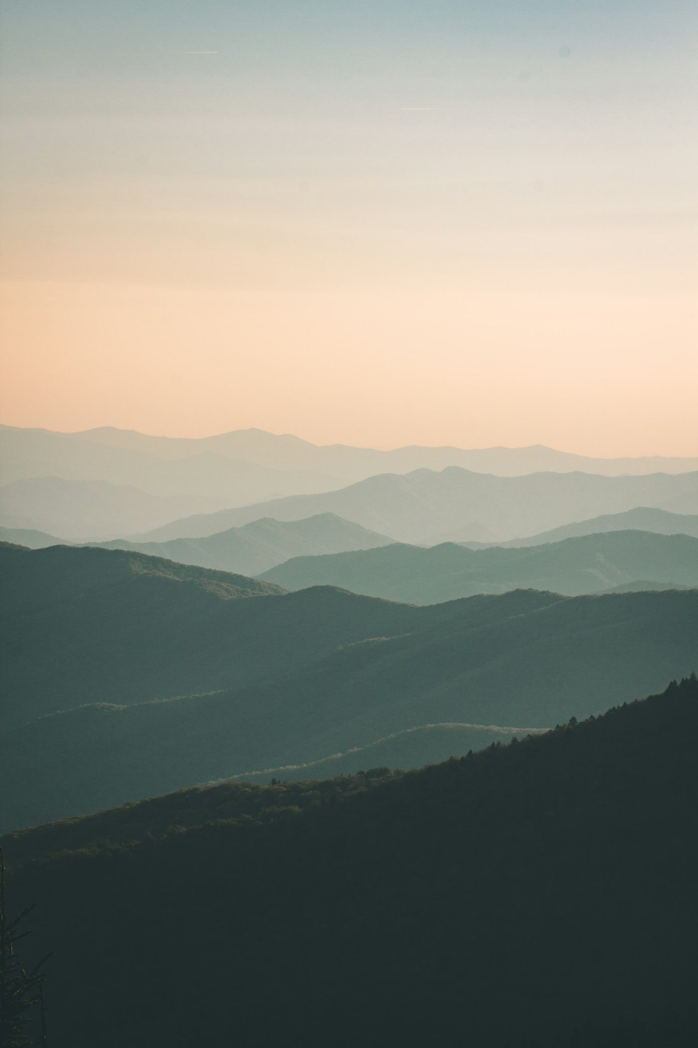 Soft desert ridges under a warm sky