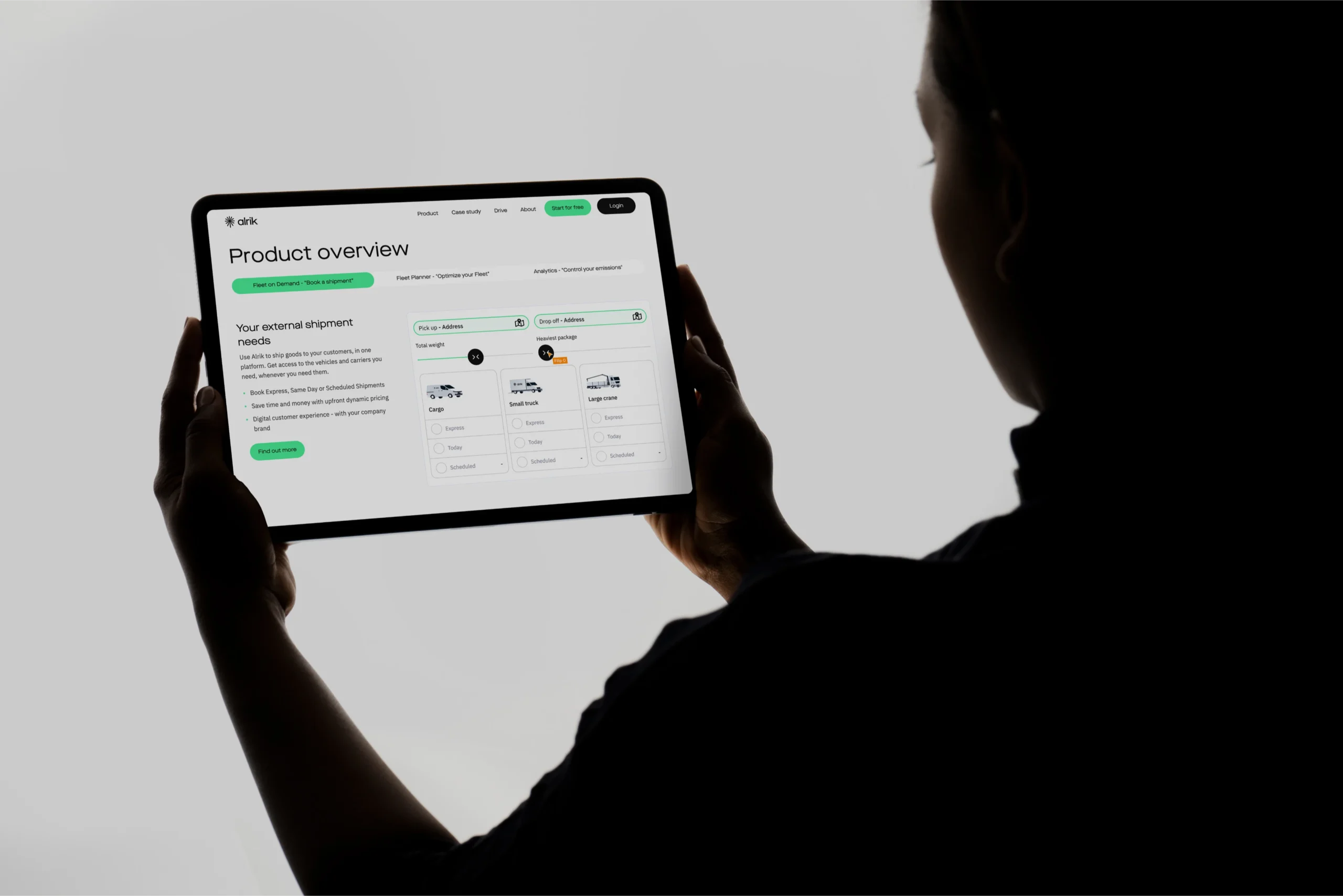 Person viewing Alrik's product overview on a tablet screen.