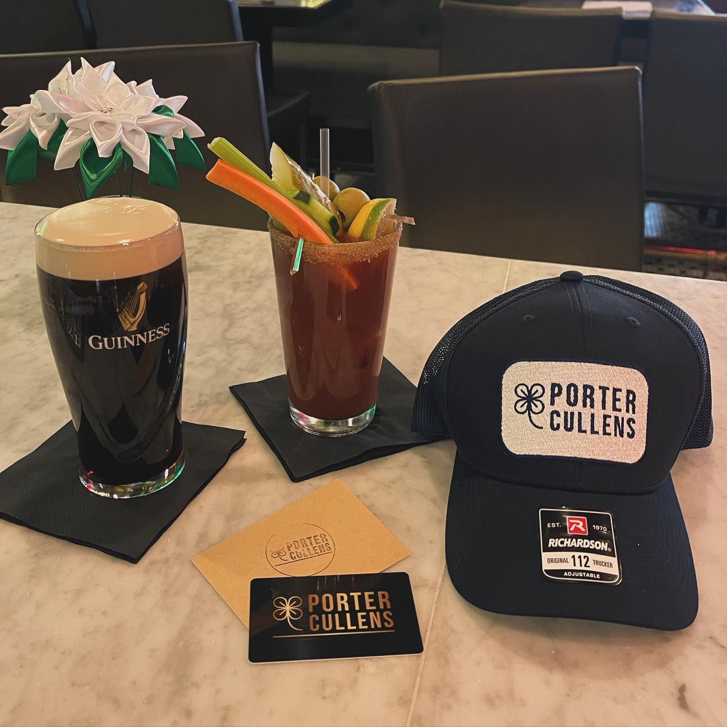 Guinness and a bloody mary with a Porter Cullens cap