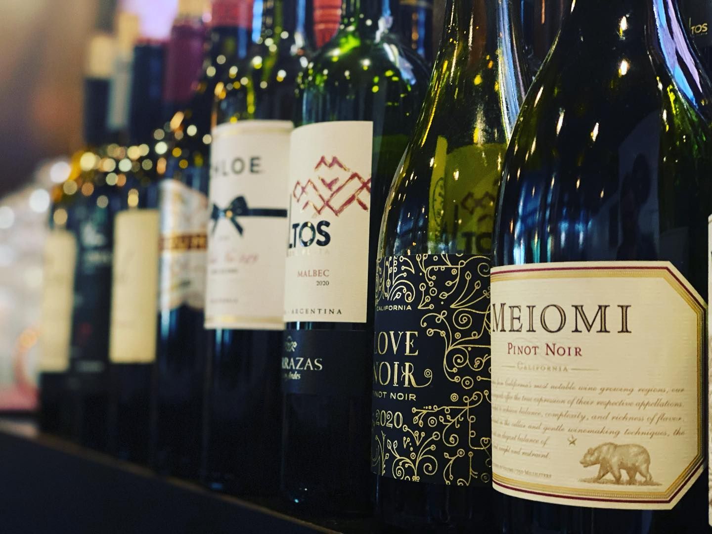 Row of wine bottles along the bar