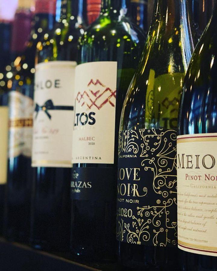Row of wine bottles along the bar